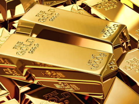 الذهب يسجل استقراراً بدعم من ارتفاع الدولار الأمريكي